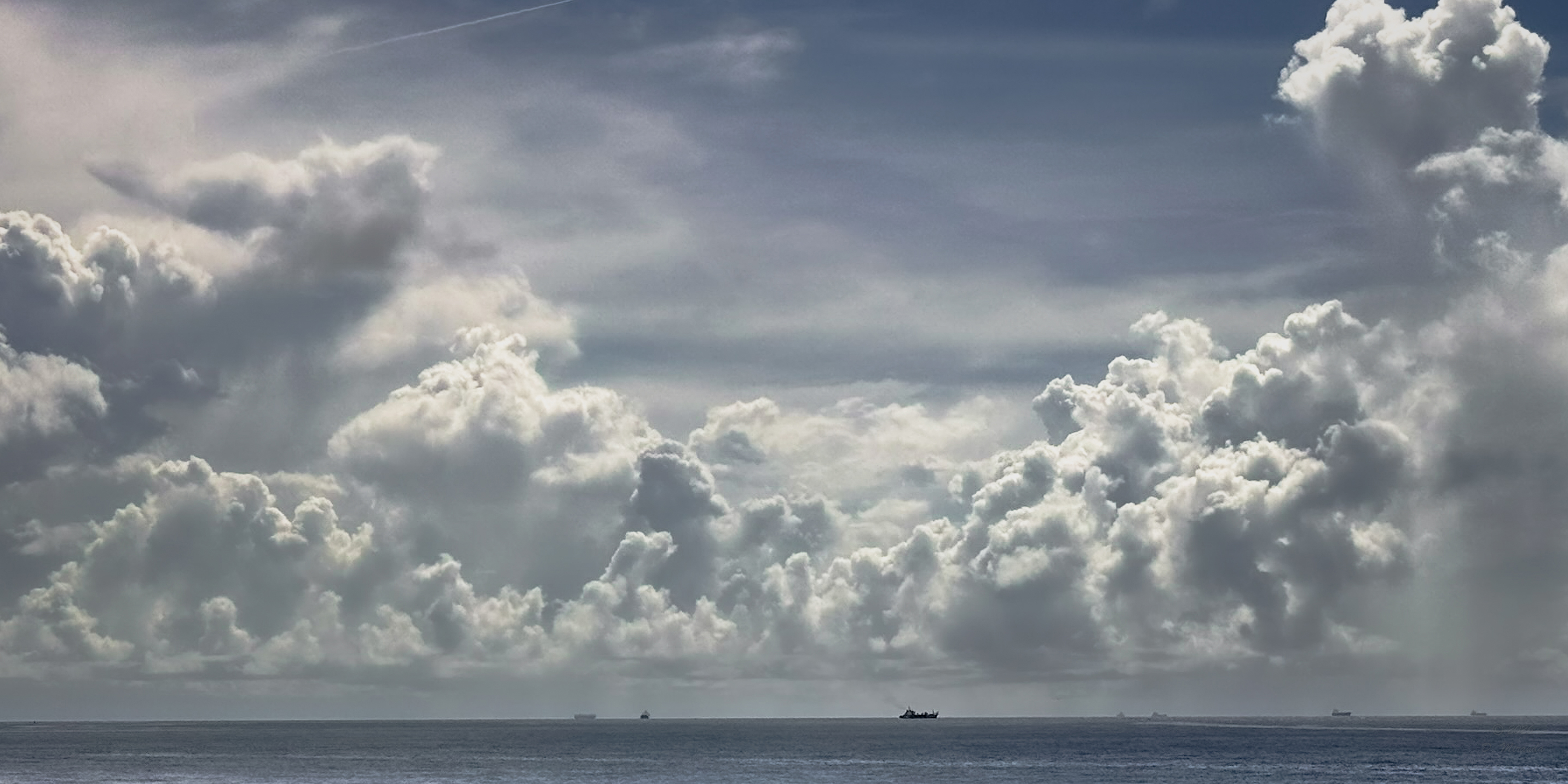 Cloud-filled coastal sky